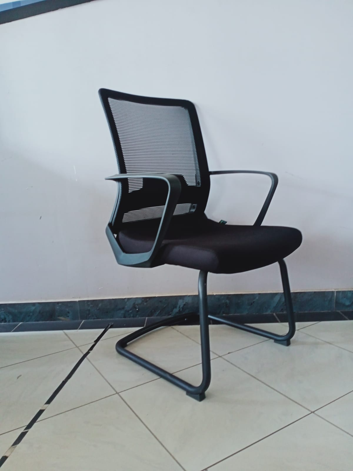Ergonomic Mesh Visitor Office Chair with Sled Base and Armrests – Breathable Blue Back, Black Cushioned Seat