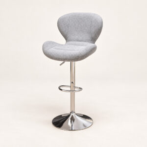 Light grey upholstered adjustable bar stool with chrome pedestal and round base on a clean studio background