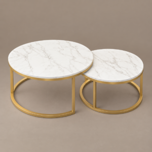 Two round white marble-look nesting coffee tables with gold frames